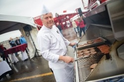 A chef from the Centurion Conference & Event Centre prepares a barbeque lunch for guests at the community opening of Tomlinson’s new waste recovery centre on June 11 in Carp.