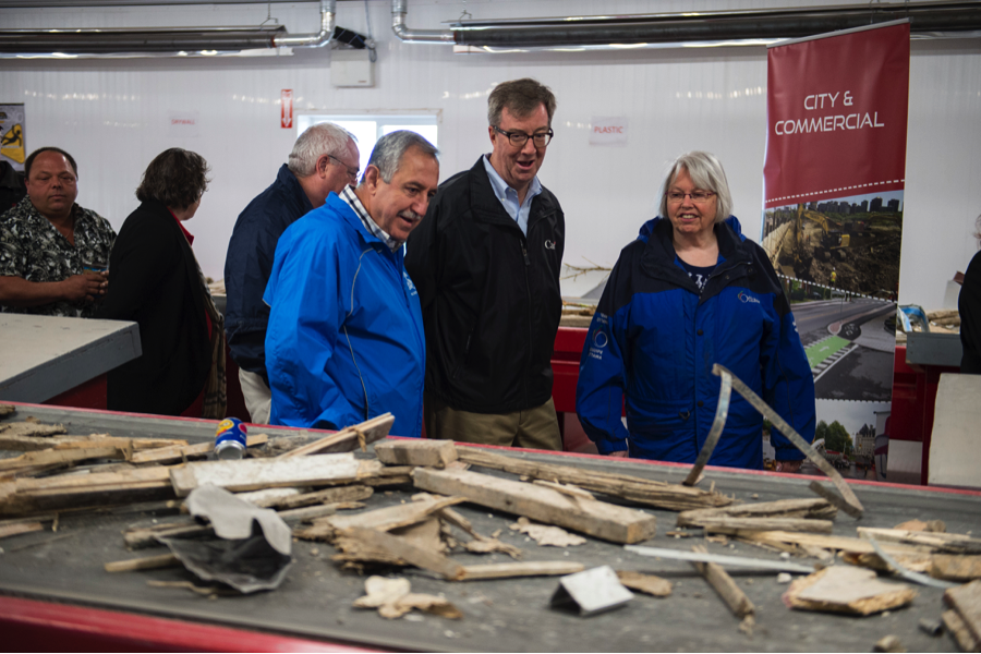Ottawa Mayor Jim Watson, centre, takes a tour of Tomlinson’s new waste recovery centre in Carp at the community opening event on June 11. He is joined by Councillors Eli El-Chantiry and Marianne Wilkinson.