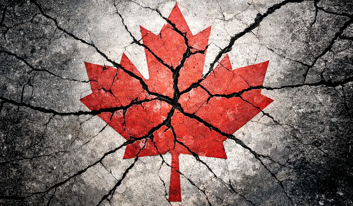 Cracked red maple leaf symbolizing division within Canada